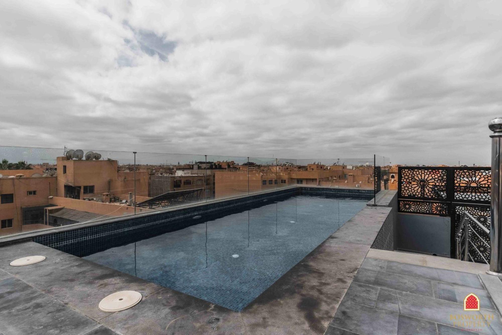 Appartement Rooftop Pool, Bright & Cozy In City Center Marrakesh